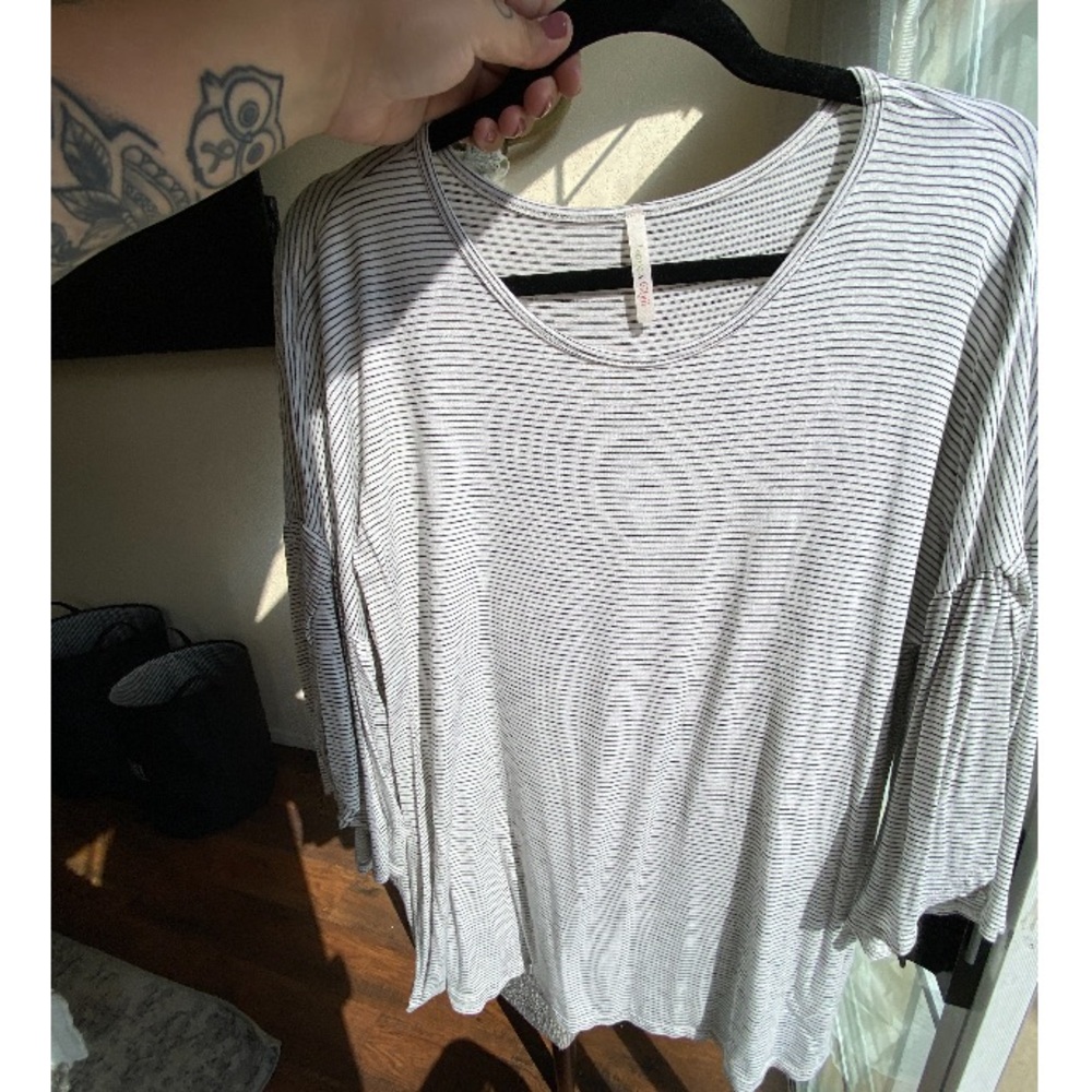 Striped blouse with slit arms, size large.